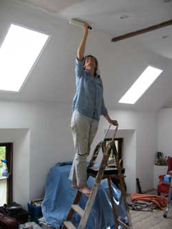Tania paints the ceiling