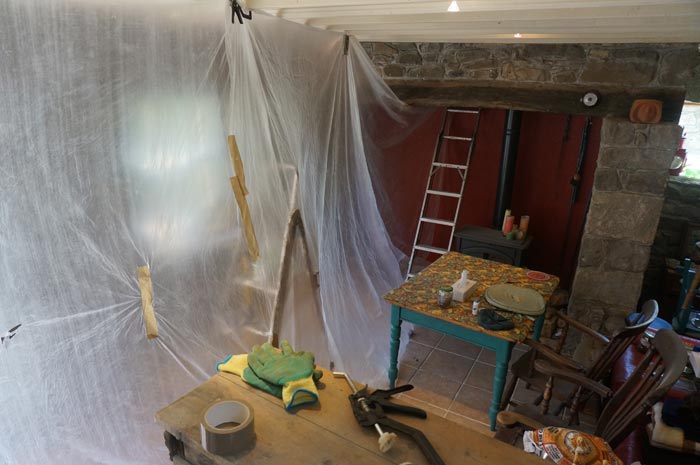 plastic dust barrier across living room